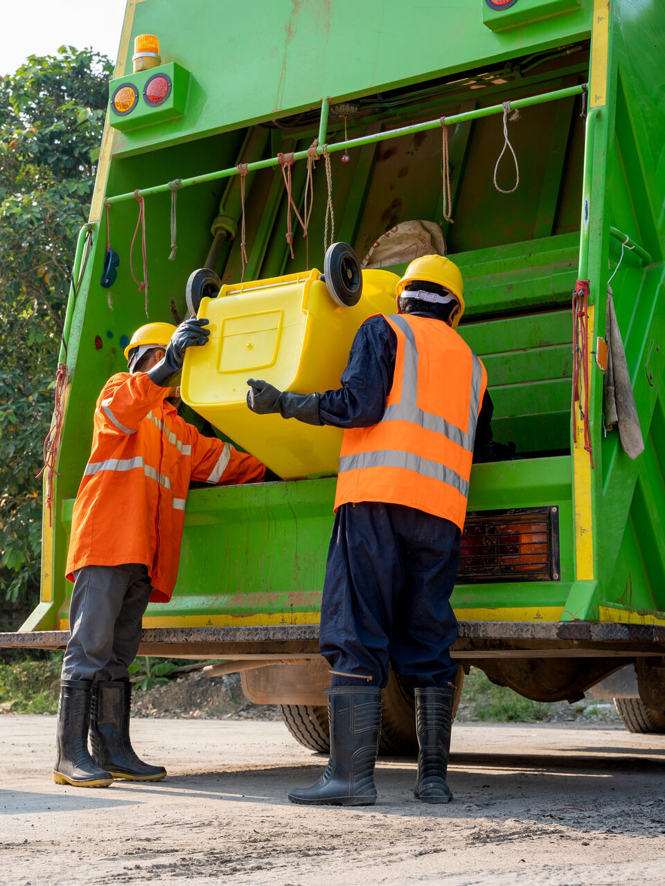 Workers collect garbage with Garbage collection truck,Concept of cleanliness and prevention of germs.